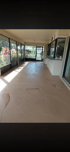 Screened lanai floor restored with a flagstone-pattern stamped concrete finish in Clearwater, FL